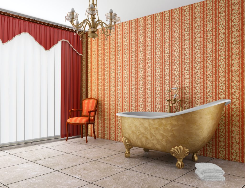 classic bathroom with old bathtub and red striped wall